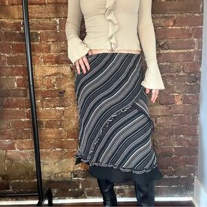 Silk Black and white striped midi skirt with ruffles and flared bottom